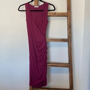 Short sleeve plum colored form fitting faux wrap dress